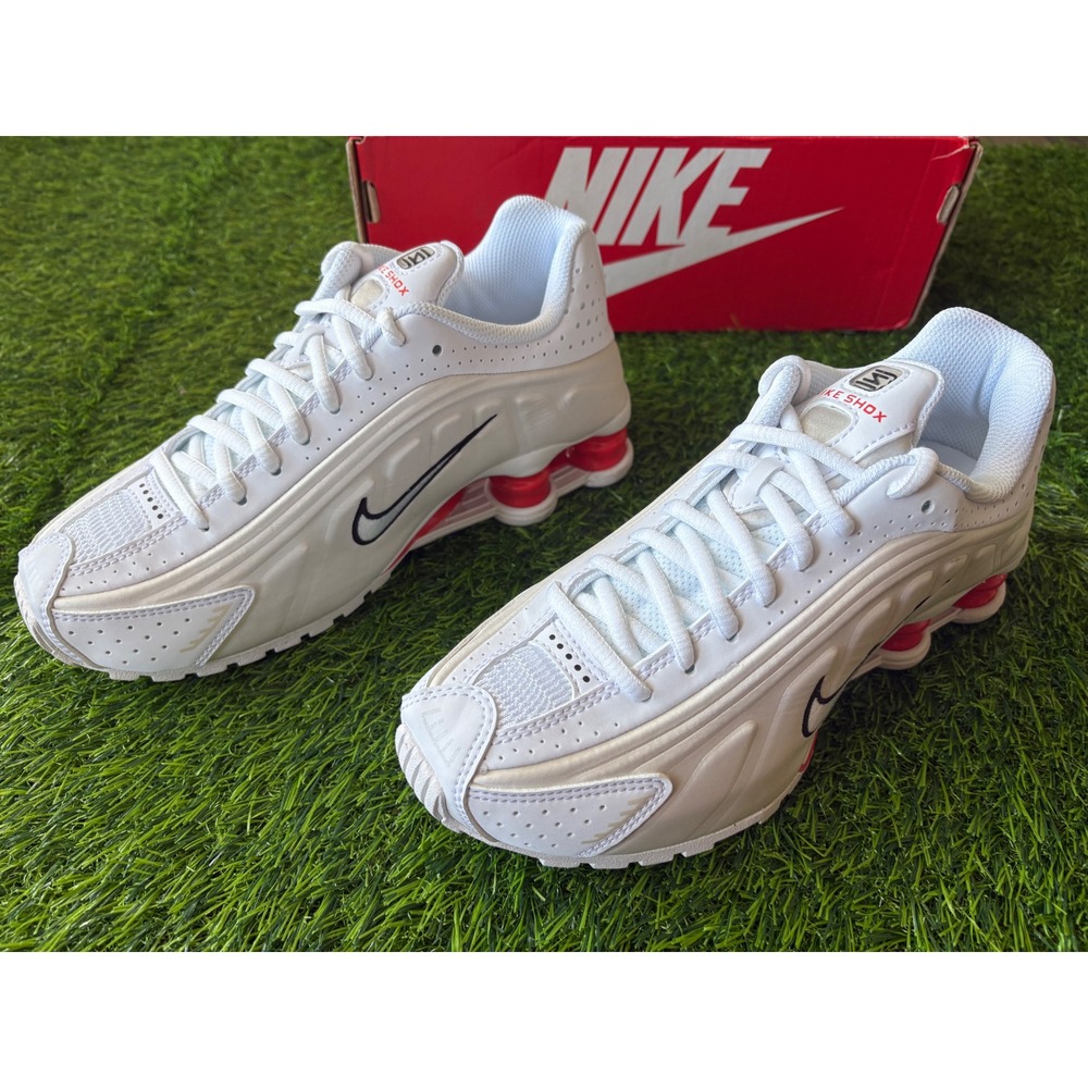 Nike Women's White Sneakers with Black Swoosh and Red Accents
